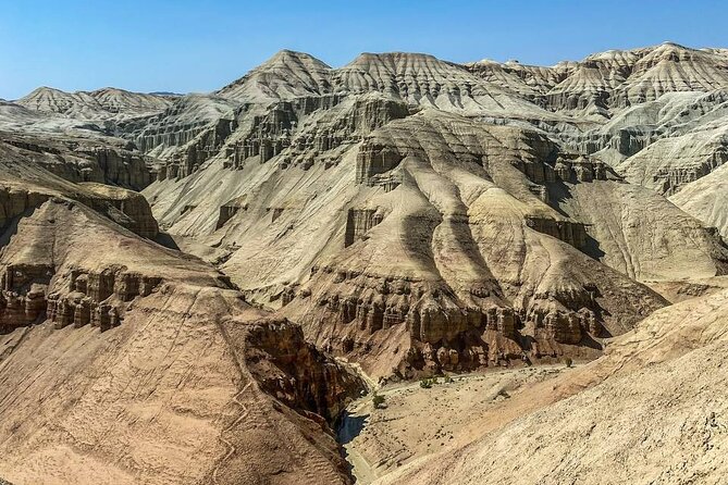 Singing dunes & Aktau mountains group tour to Altyn Emel - Aktau Mountains: pale rock shaped like a dry ocean